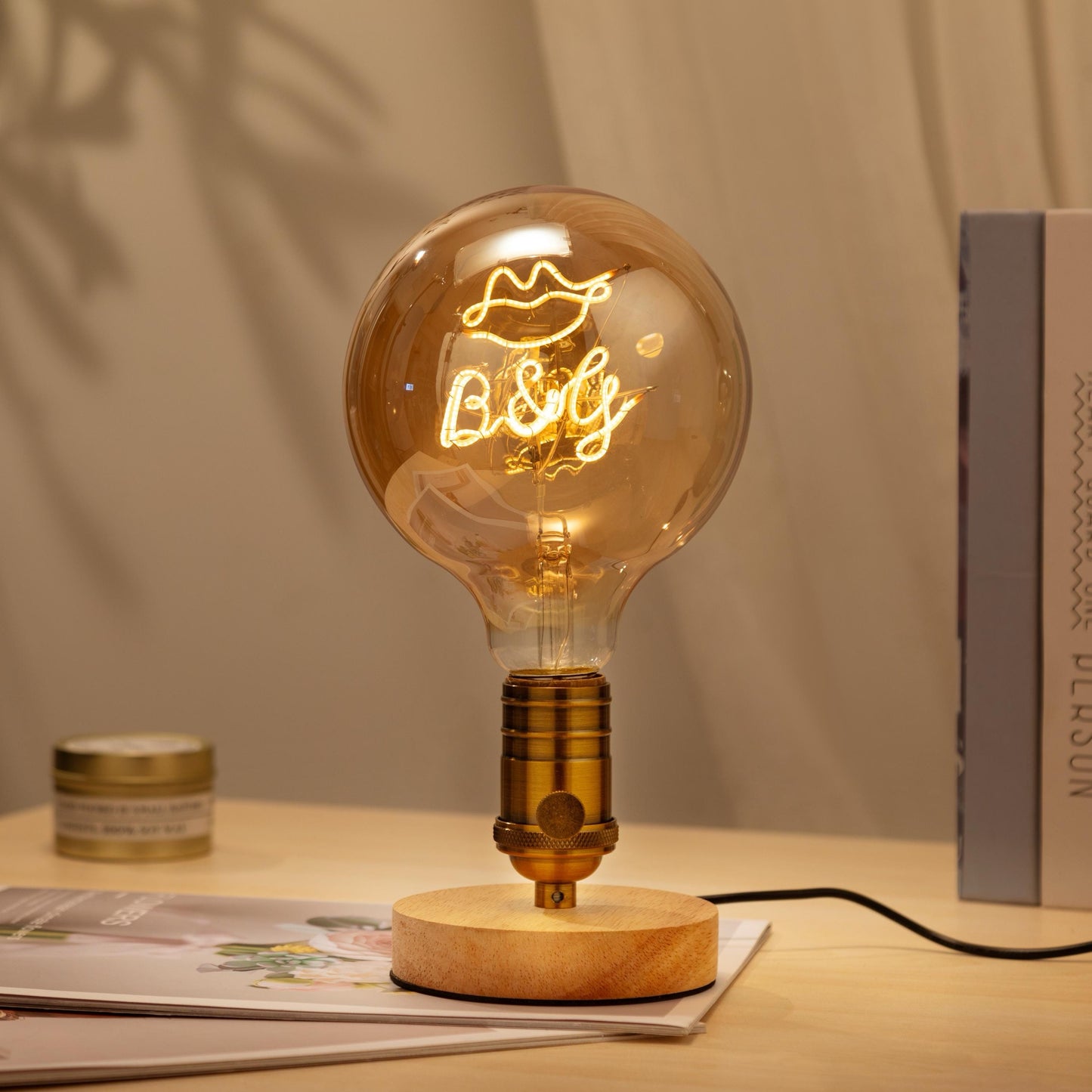 Personalized Edison bulb table lamp with a custom text filament and a bronze base