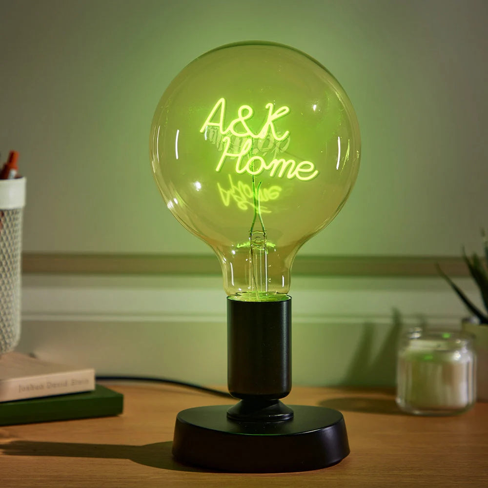 Personalized Edison bulb table lamp with a custom text filament green light