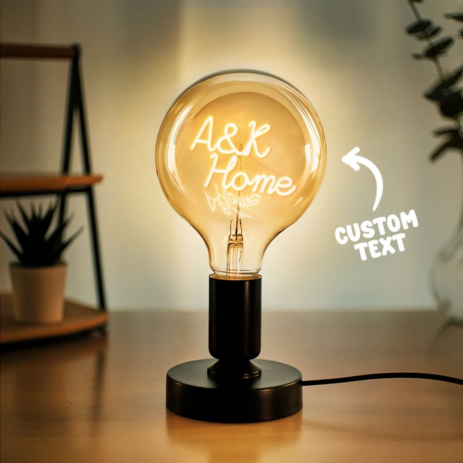 Personalized Edison bulb table lamp with a custom text filament and a black metallic base